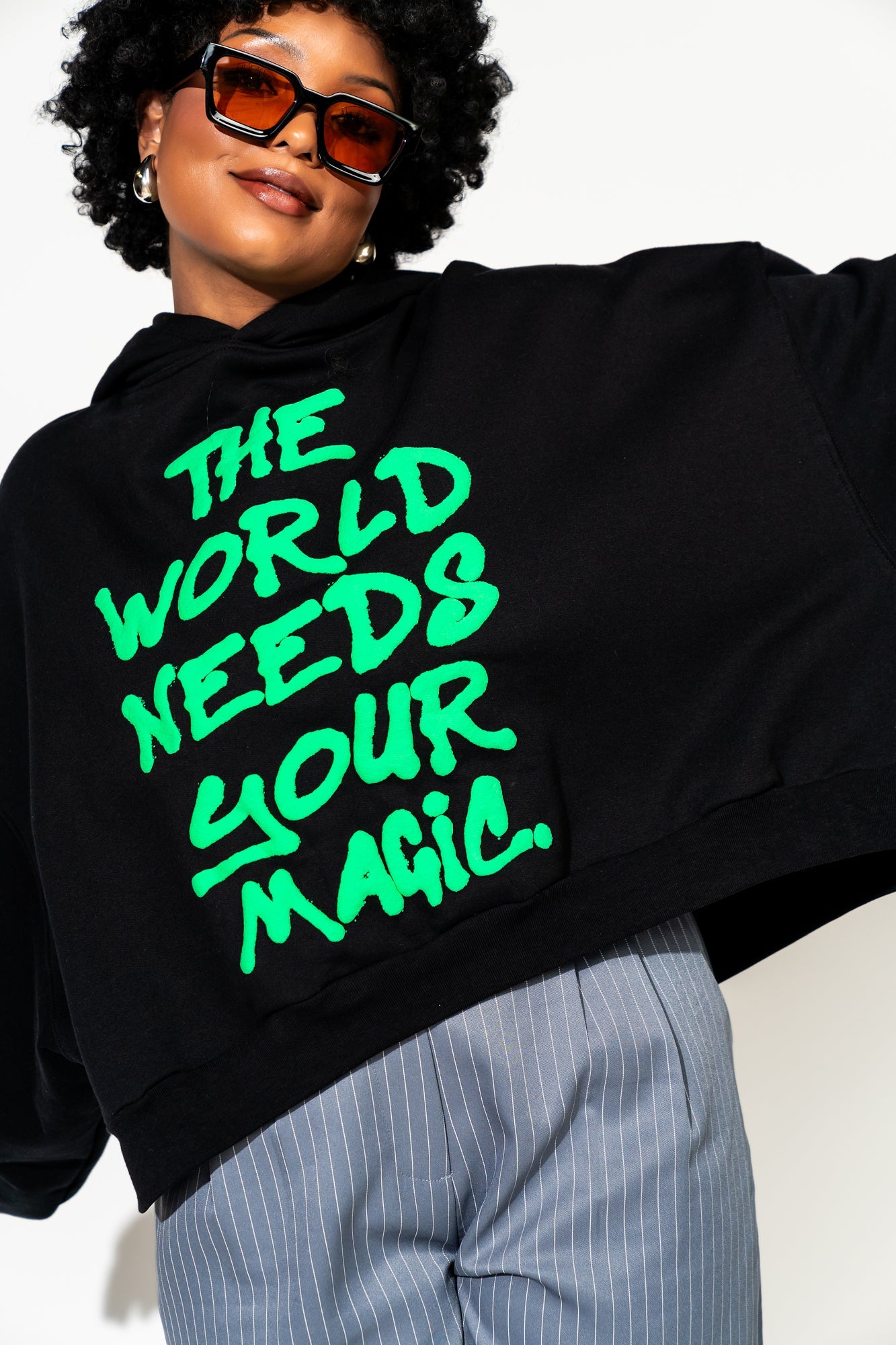 LALA ORIGINAL: Energy Doesn’t Lie Cropped Hoodie in The World Needs Your Magic Puff Print - Dressed in Lala