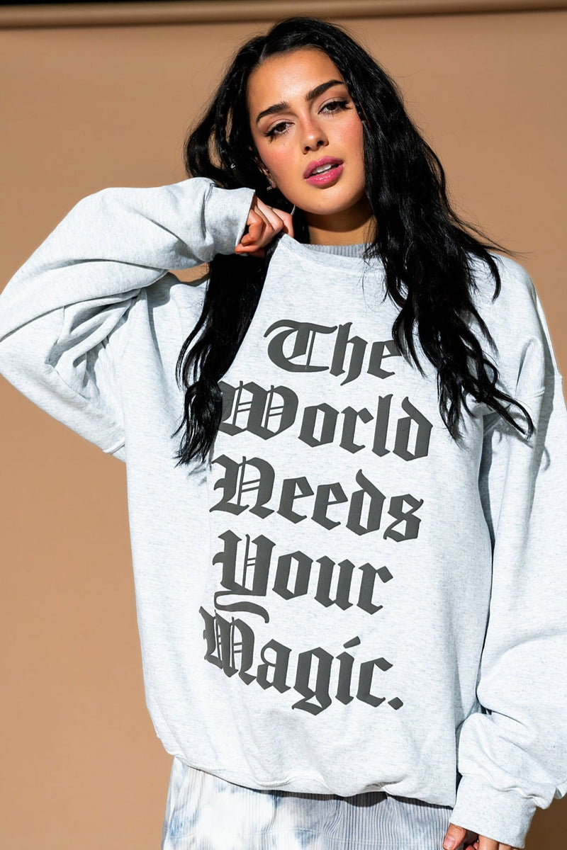 The World Needs Your Magic Mantra Oversized Puff Print Pullover in Vin
