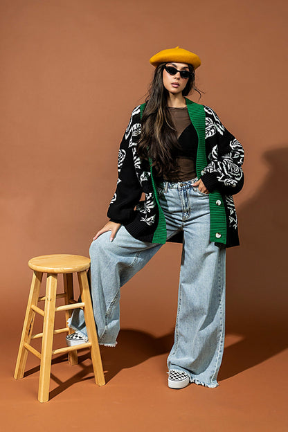 Person posing on a stool against a brown backdrop