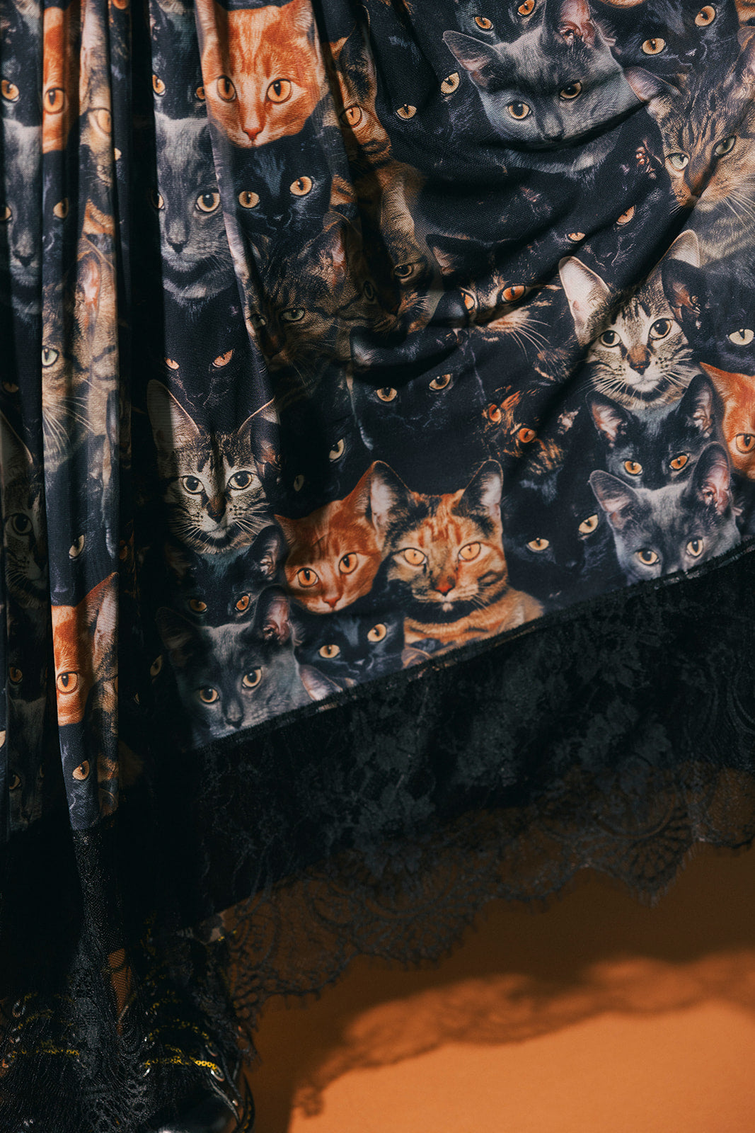 Close up of cat pattern mesh maxi skirt with lace hem.