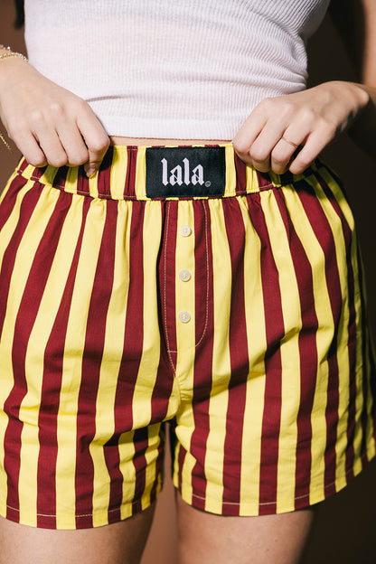 Maroon and yellow striped boxer briefs with 'lala' label.