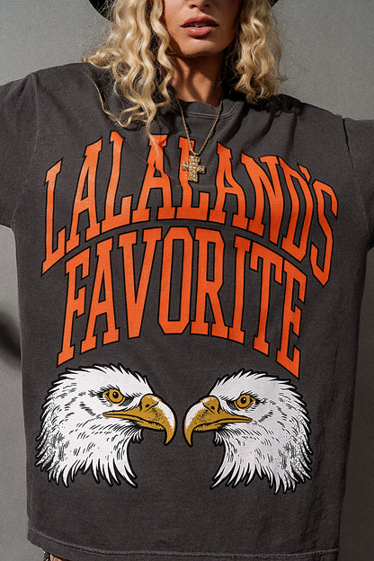 Person wearing a hoodie with 'Lalaland's Favorite' text and eagle design.