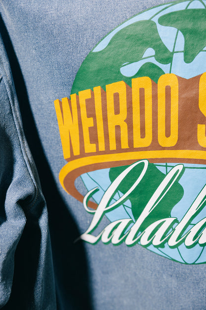 Closeup of blue denim jacket with "Weirdo Studios Lalaland" logo on the back