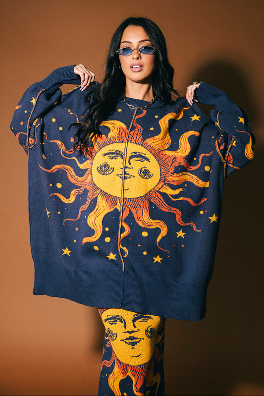 Woman wearing a blue sweater with a sun design on a brown background
