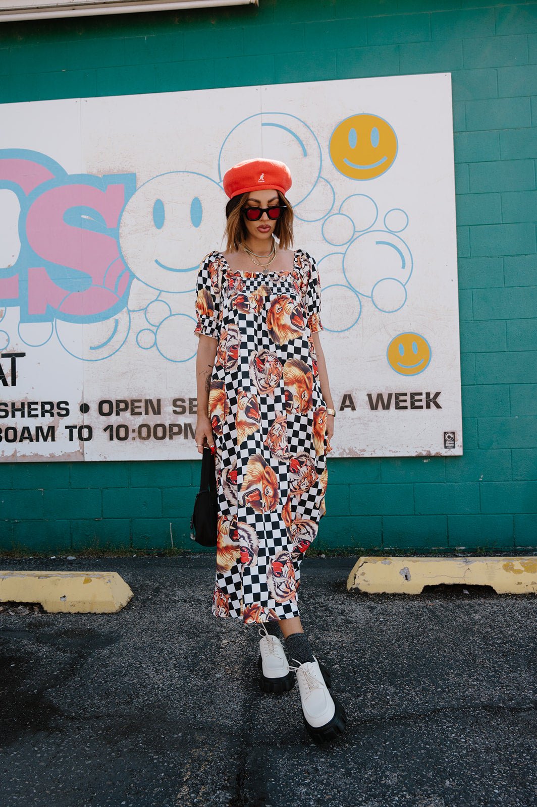 Palm Springs Smocked Dress in Lions, Tigers, Check, Oh My! L Palm Springs Smocked Dress in Lions, Tigers, Check, Oh My! L