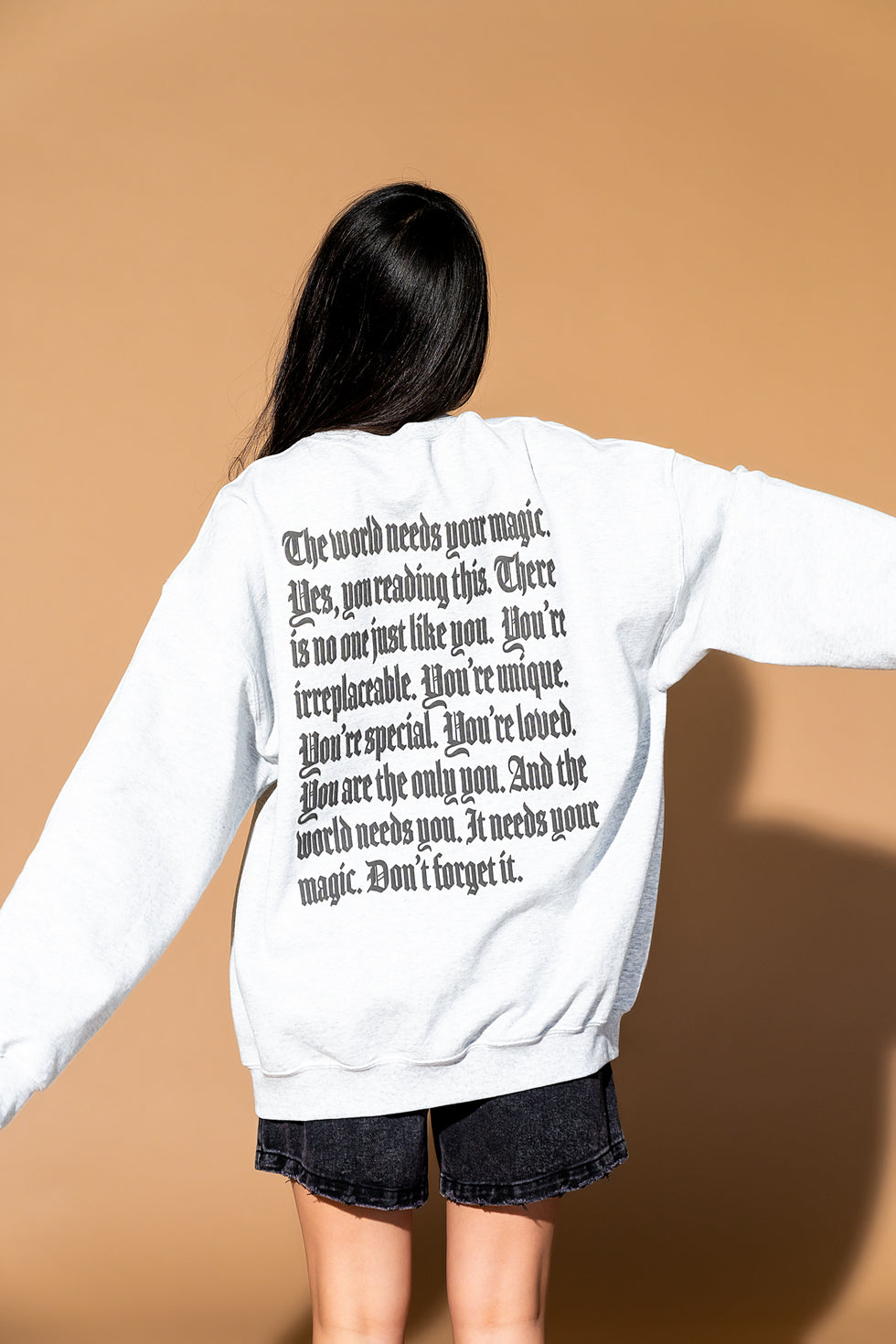 The World Needs Your Magic Mantra Oversized Puff Print Pullover in Vin