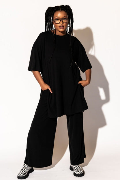 LALA ORIGINAL: Leveled Up Ribbed Playsuit in Black - Dressed in Lala